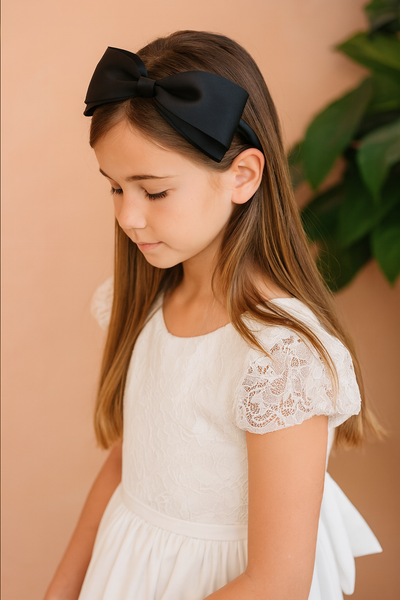 Isabella Headband with a pink satin drawstring bag.