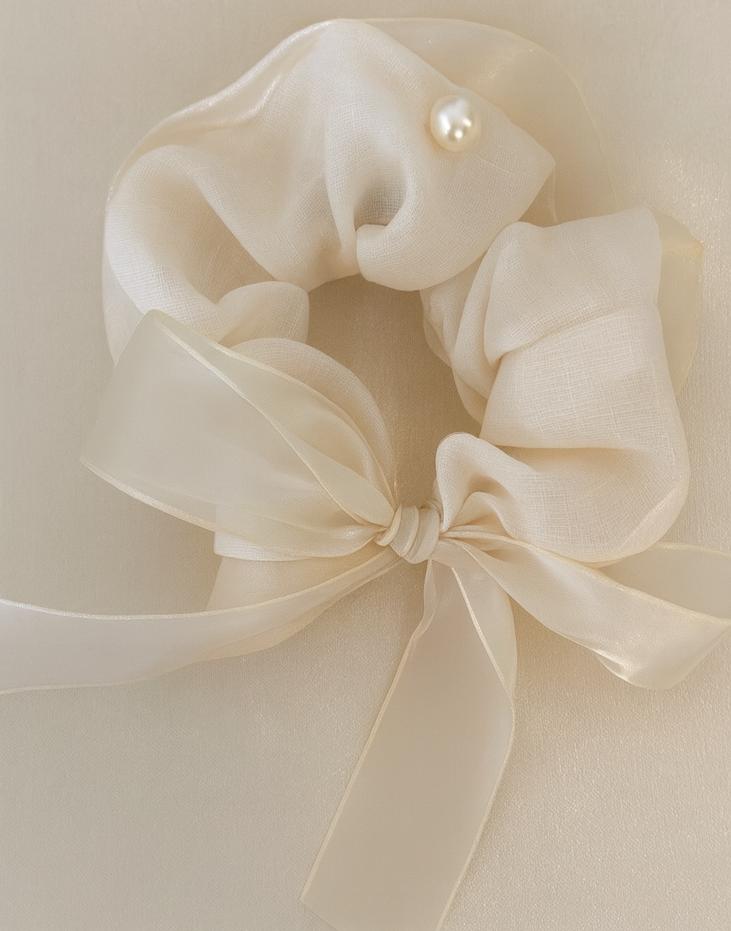 Dream Scrunchie with a pink satin drawstring bag.