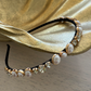 Genevieve Headband (Ages 3 upwards) with a pink satin drawstring bag.