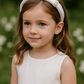 Fleur ~ Satin Headband (Ages 2-Adult) with a pink satin drawstring bag.