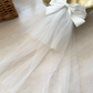 Catherine Communion Barrette (Ages 3 upwards) with a pink satin drawstring bag.