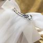 Catherine Communion Barrette (Ages 3 upwards) with a pink satin drawstring bag.