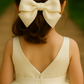 Sugar Cream Bow Barrette with a pink satin drawstring bag.