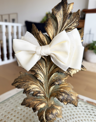 Sugar Cream Bow Barrette with a pink satin drawstring bag.