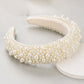 Dreamy Pearl Headband (Ages 6 upwards) with a pink satin drawstring bag.