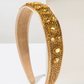 Gilded Sun Headband (Ages 6-Adult) with a pink satin drawstring bag.