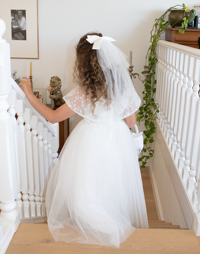 Catherine Communion Barrette (Ages 3 upwards) with a pink satin drawstring bag.