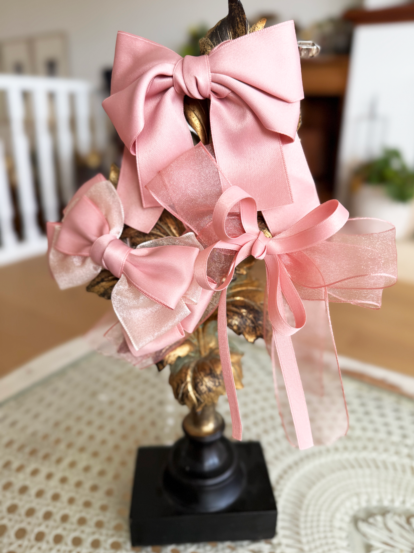 Sugar Rose Bow Barrette with a pink satin drawstring bag.