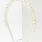 Poppy Pearls Headband (Ages 3 upwards) with a pink satin drawstring bag.