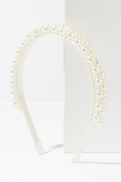 Poppy Pearls Headband (Ages 3 upwards) with a pink satin drawstring bag.