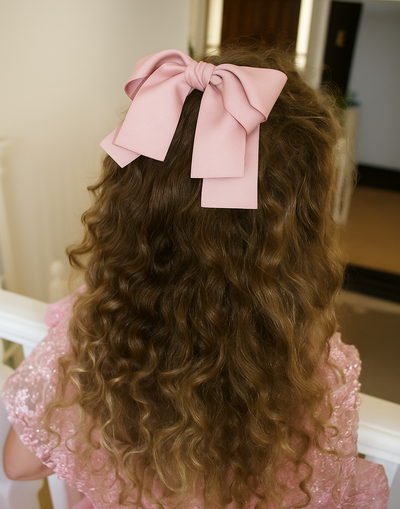 Rose Bow Barrette (Ages 3 upwards) with a pink satin drawstring bag.