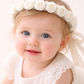 Roma Baby Headband (Ages 0-6m ) with a pink satin drawstring bag