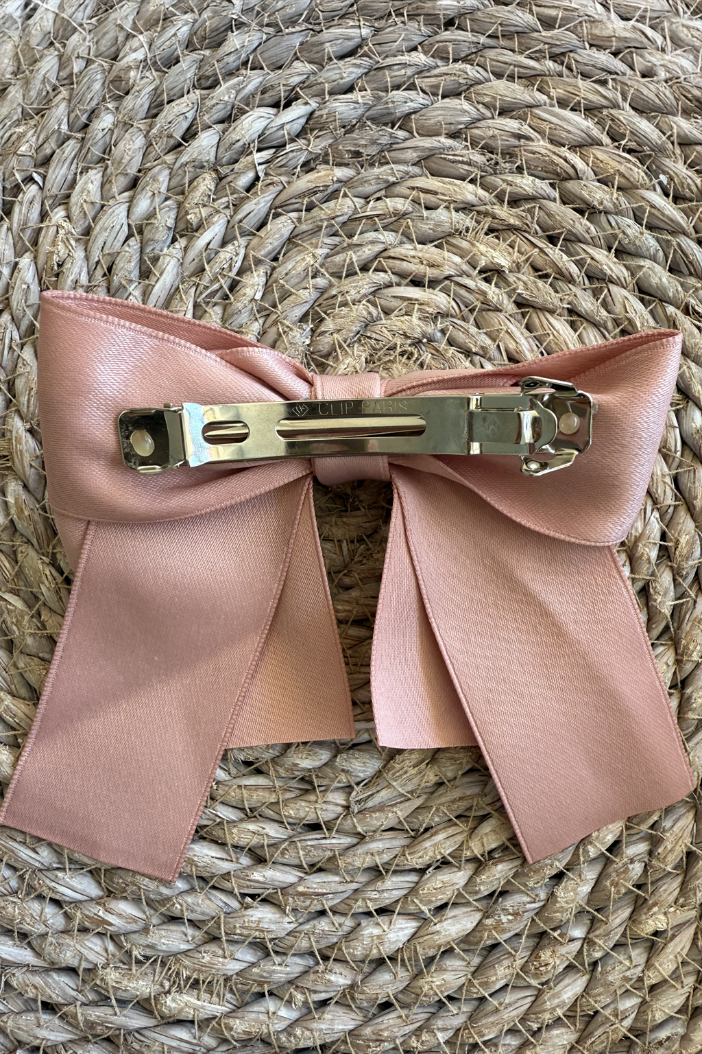 Rose Bow Barrette (Ages 3 upwards) with a pink satin drawstring bag.