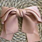 Rose Bow Barrette (Ages 3 upwards) with a pink satin drawstring bag.
