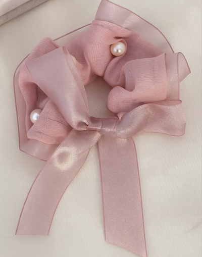 Rosie Scrunchie with a pink satin drawstring bag.