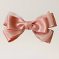 Sugar Rose Bow Barrette with a pink satin drawstring bag.