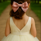 Sugar Rose Bow Barrette with a pink satin drawstring bag.
