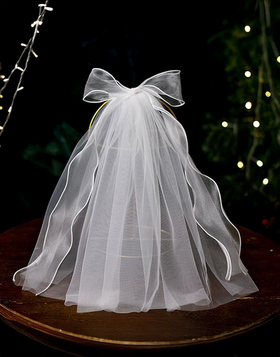 Angel Communion Veil/Headband (Ages 3 upwards) with a pink satin drawstring bag.